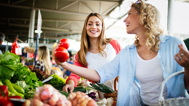 Women shopping for produce
