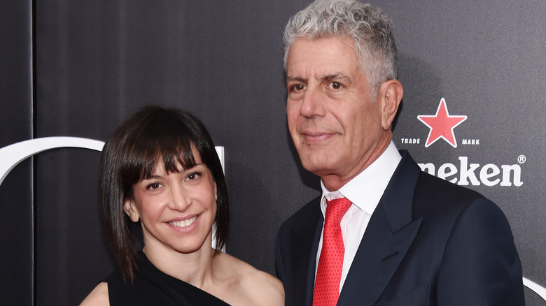 Anthony Bourdain with former wife Ottavia Busia beside him