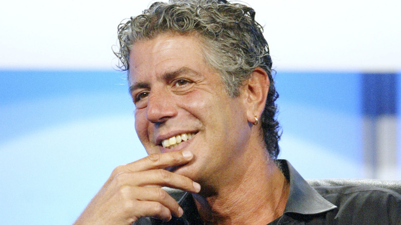 Anthony Bourdain with hand to his chin