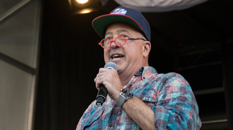 Andrew Zimmern speaking at an event 