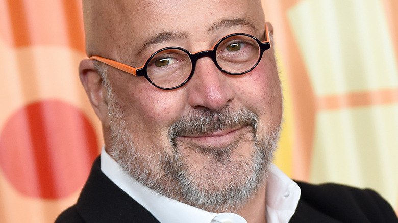 Andrew Zimmern wearing glasses