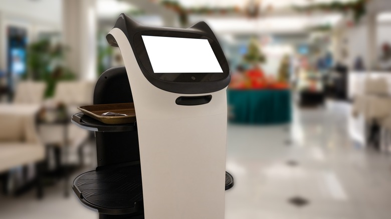 Robot in an eatery with food tray