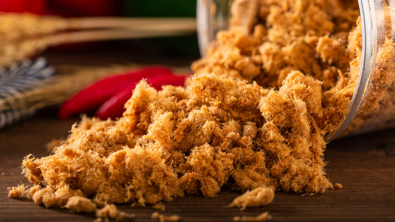 pork floss tumbling from jar