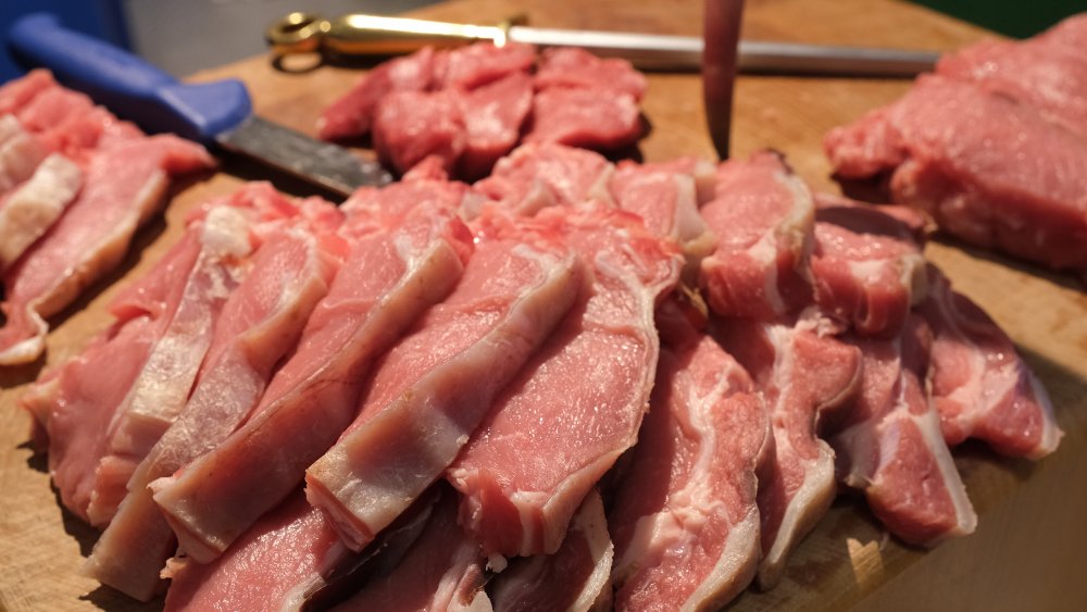raw pork on cutting board