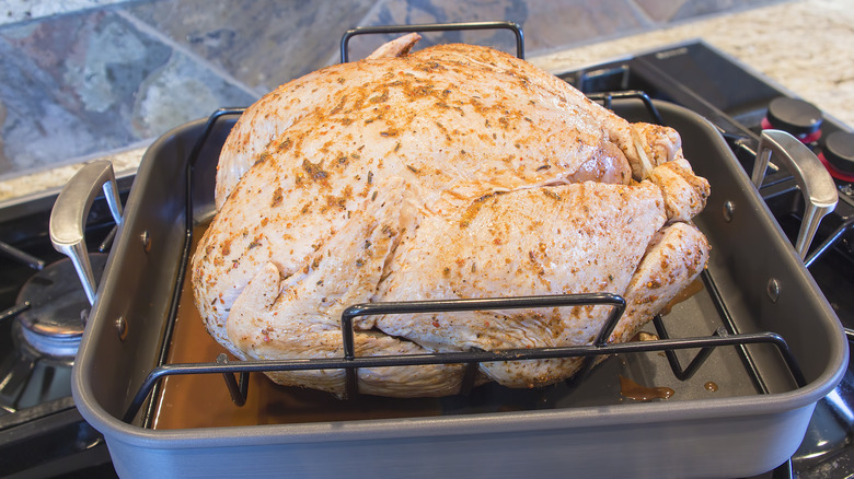 Raw Thanksgiving turkey in pan