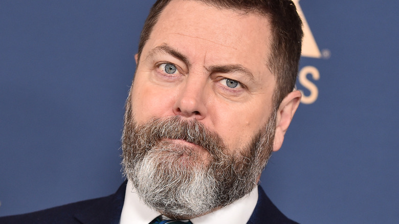 Closeup of Nick Offerman wearing suit and tie