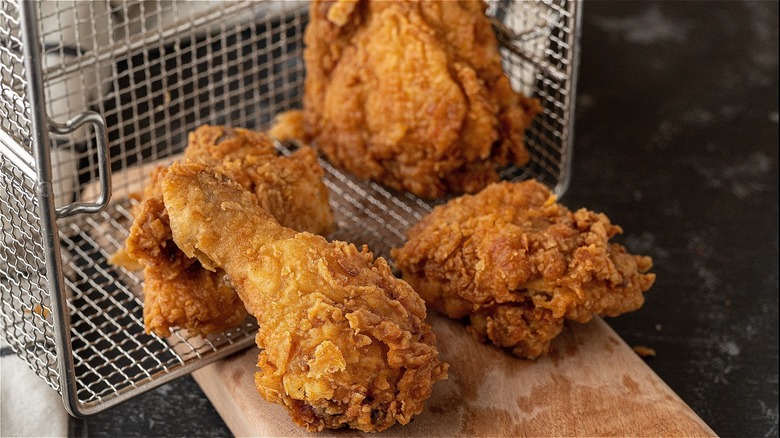 Fried chicken in fryer basket