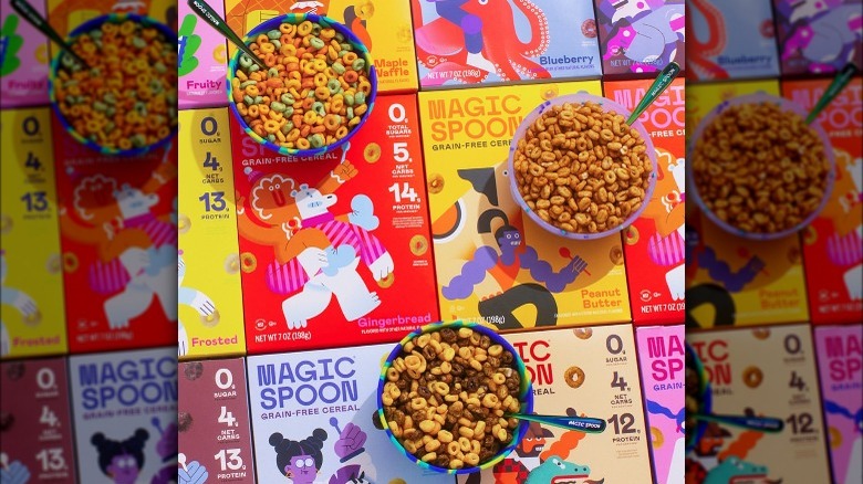 boxes of Magic Spoon cereal with bowls of cereal on top 
