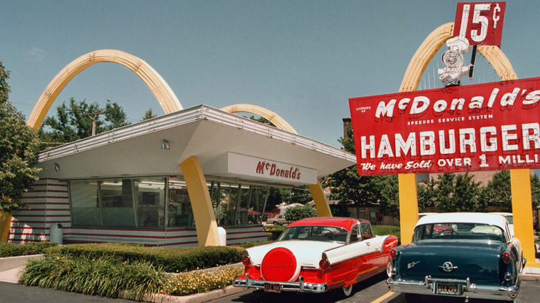 Vintage cars parked at a historic McDonald's