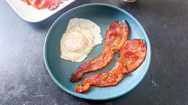 candied bacon with fried eggs
