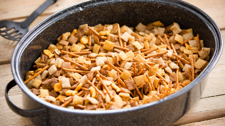 Chex mix in a black pan