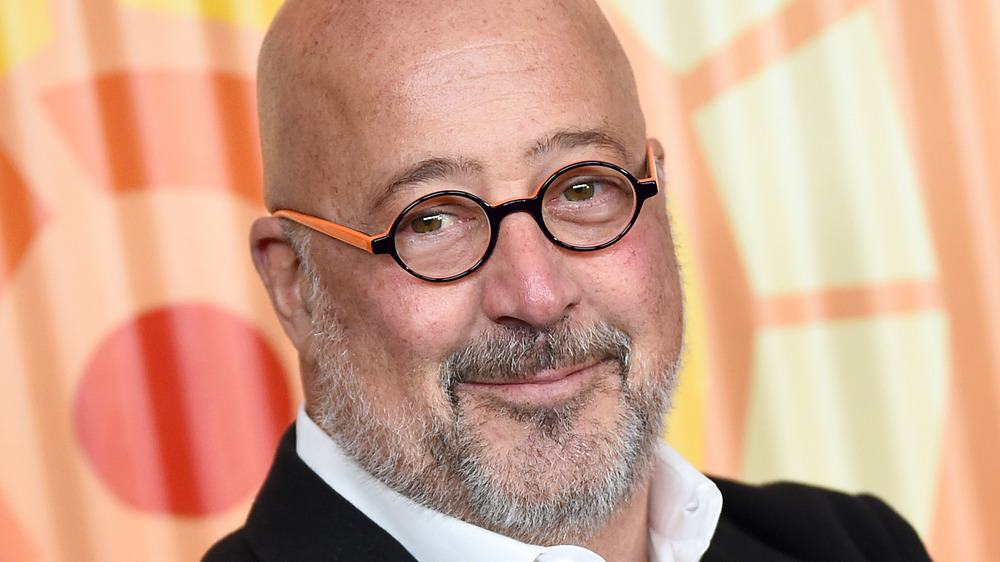 Andrew Zimmern orange glasses