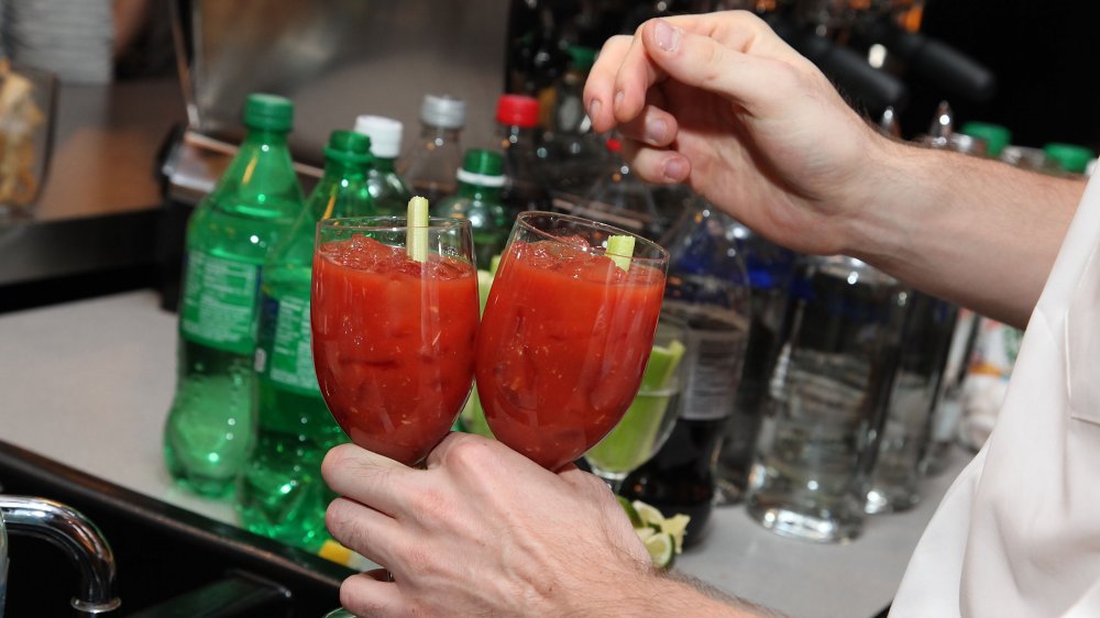 bartender making two bloody marys