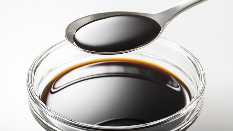 Bowl and spoon of Worcestershire sauce