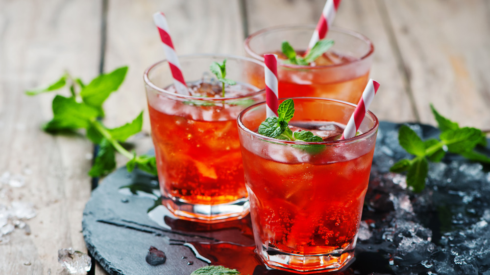 Red sodas on a stone plate