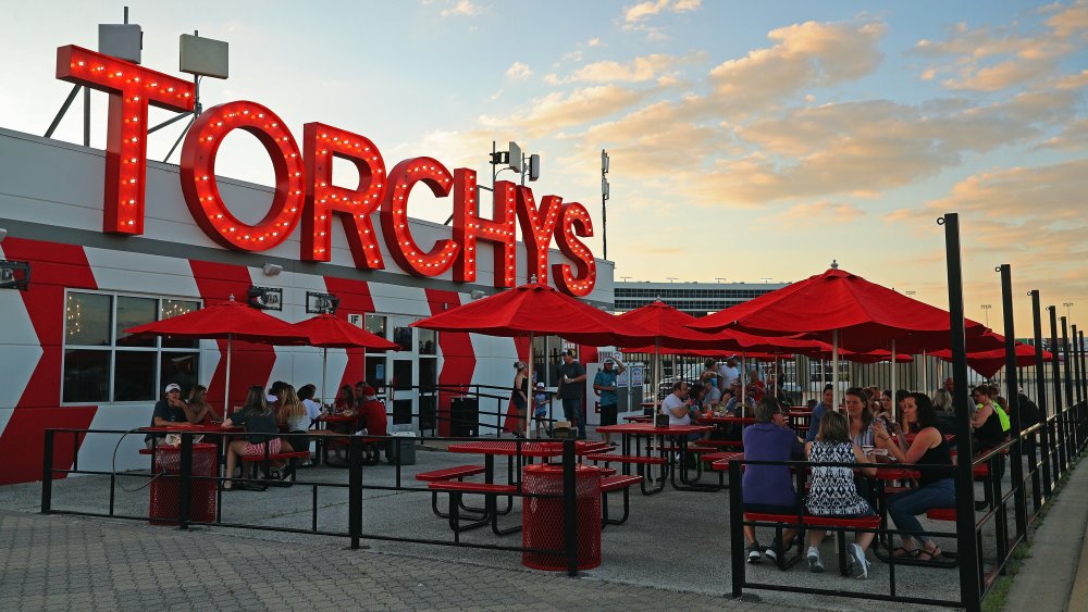 Customers eating outside at Torchy's Tacos