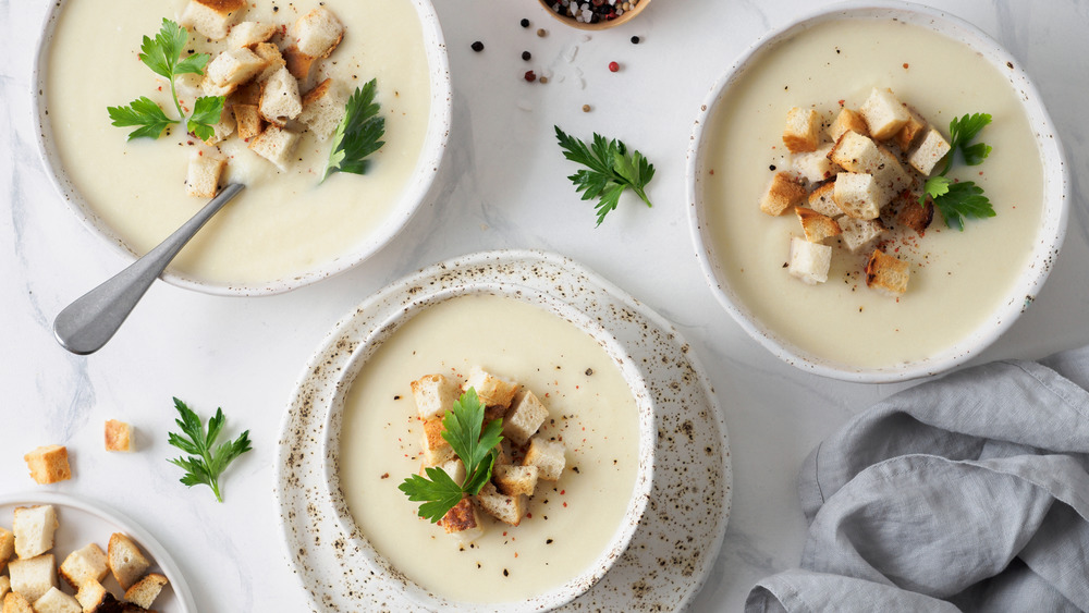 Three bowls of potato soup 