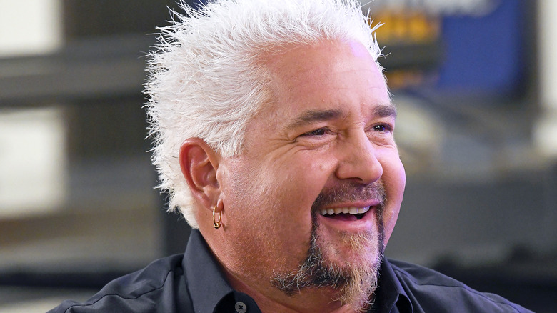 Guy Fieri smiling at event 