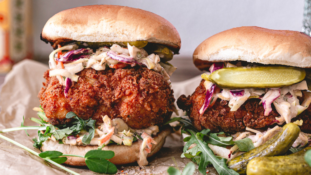 Two fried chicken sandwiches with coleslaw