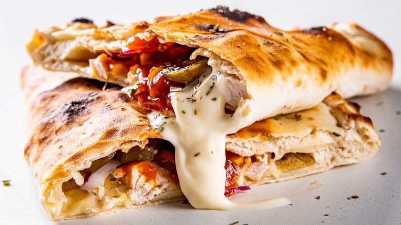 Calzone pizza with cheese oozing out
