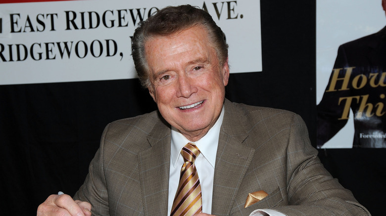 Regis Philbin smiling at book signing
