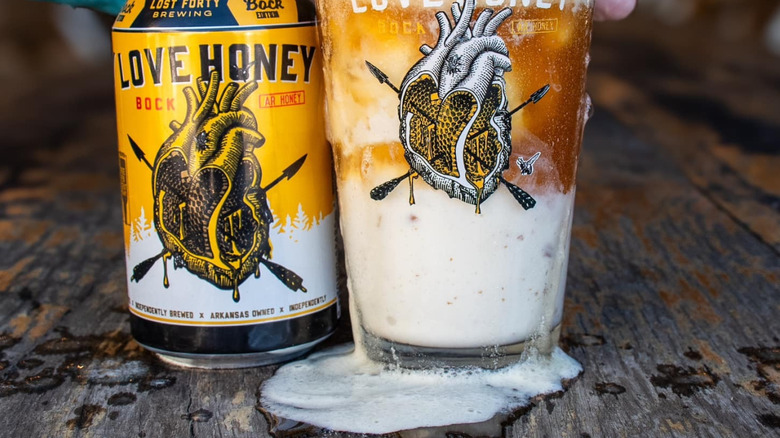 Love Honey Bock can beside beer float in glass