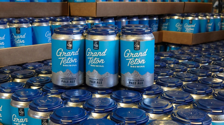 a bunch of Sweetgrass Pale Ale cans