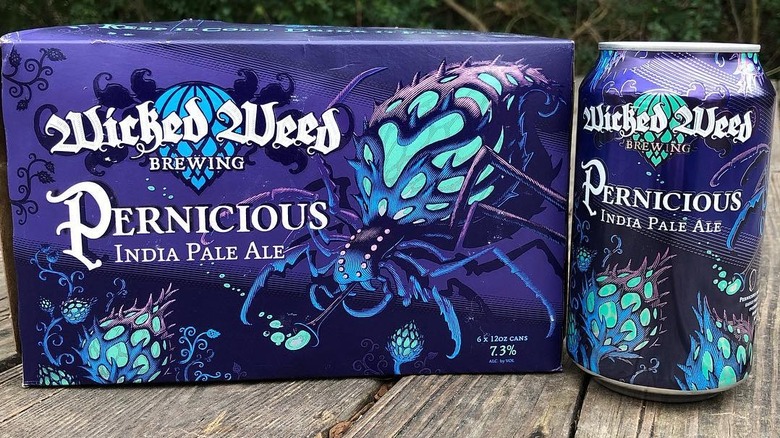 cardboard box beside can of Pernicious IPA