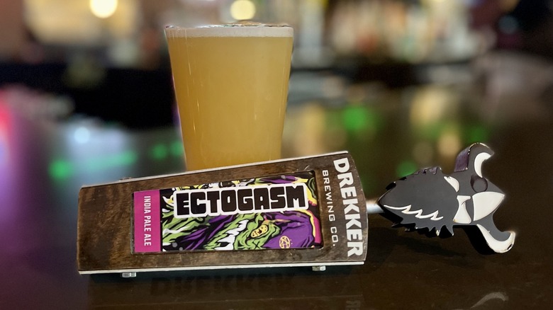 Drekker Ectogasm tap beside full beer bottle