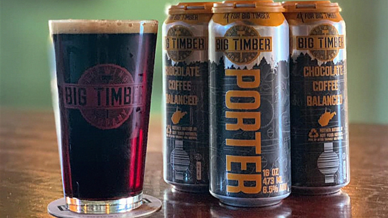 three big timber cans with full glass