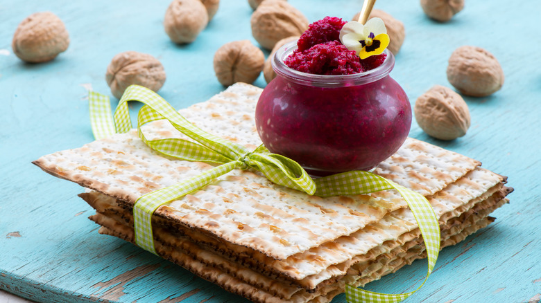 Maror/horseradish in a jar on stack of matzo