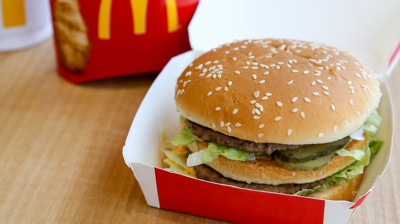 McDonald's Big Mac in box with fries in background 