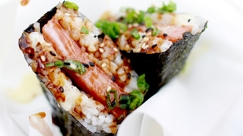 A close-up of Spam musubi with marinated Spam, rice, and nori