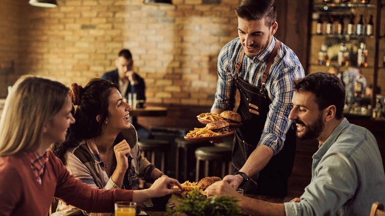 People getting served at a restaurant 