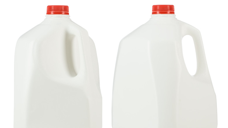 two plastic milk containers