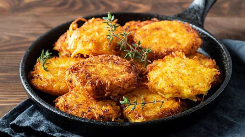 garnished latkes on a plate