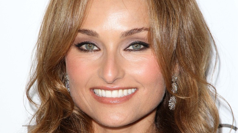 Giada De Laurentiis smiles with dangling earrings