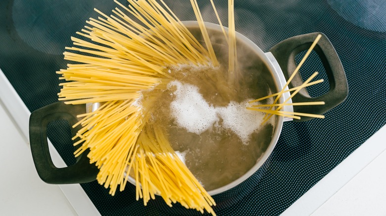 Spaghetti in pot of water