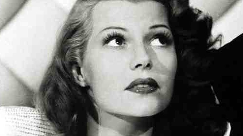 Rita Hayworth looking up