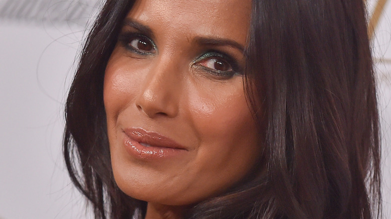 Padma Lakshmi with slight smile on the red carpet