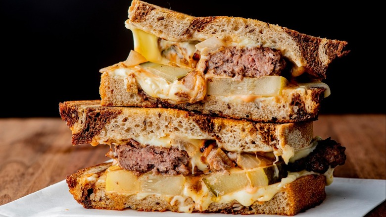 patty melt stacked on a plate