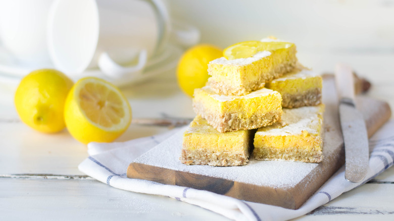 slices of lemon cake on cutting board with knife