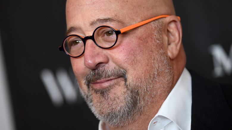 Andrew Zimmern close-up in orange glasses