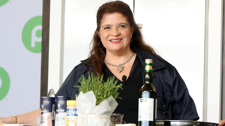 Alex Guarnaschelli smiling at a cooking event