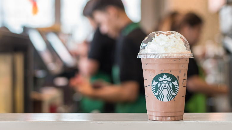 Starbucks Frappuccino on barista counter 