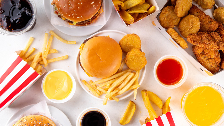 Selection of fast food items on white table