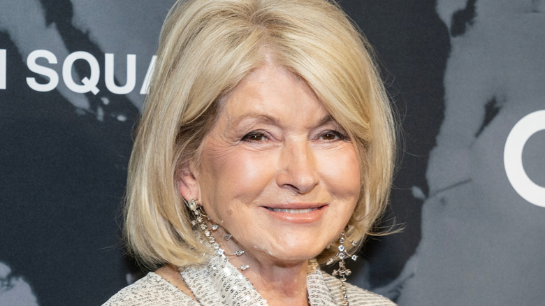 Martha Stewart in sparkly earrings attending a public event.