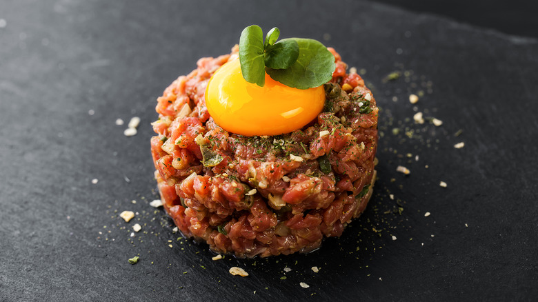 Steak tartare with an egg yolk