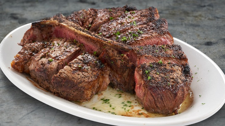 medium rare t-bone steak on plate 