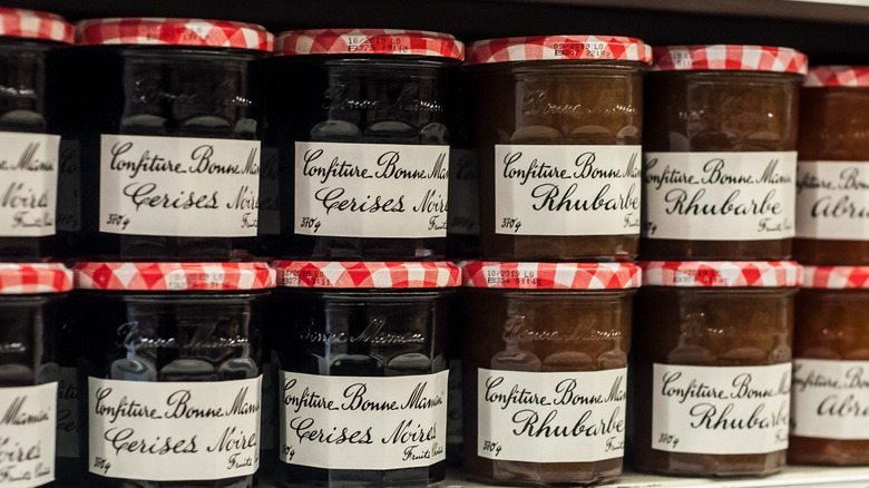 Rows of Bonne Maman jam on a shelf